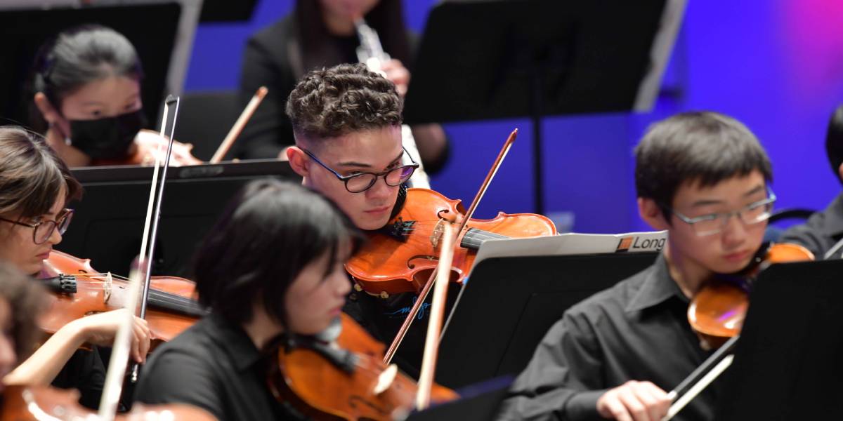 Teenagers performing in a symphony 